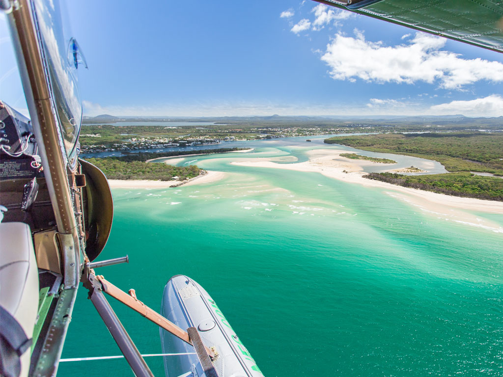 View of Noosa River mouth from seaplane with doors off