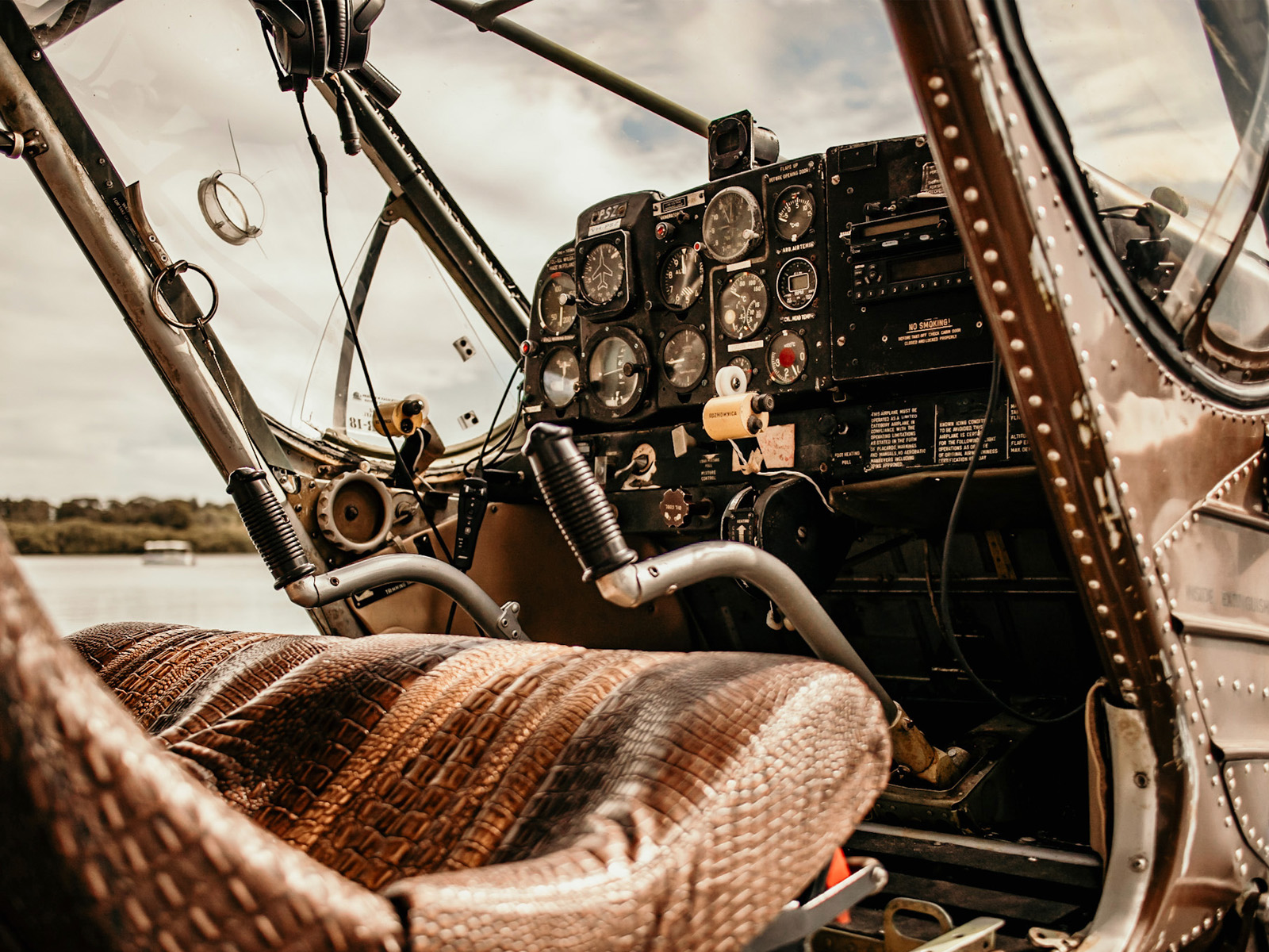 the cockpit of the Wilga 80 with faux crocodile skin seat covers