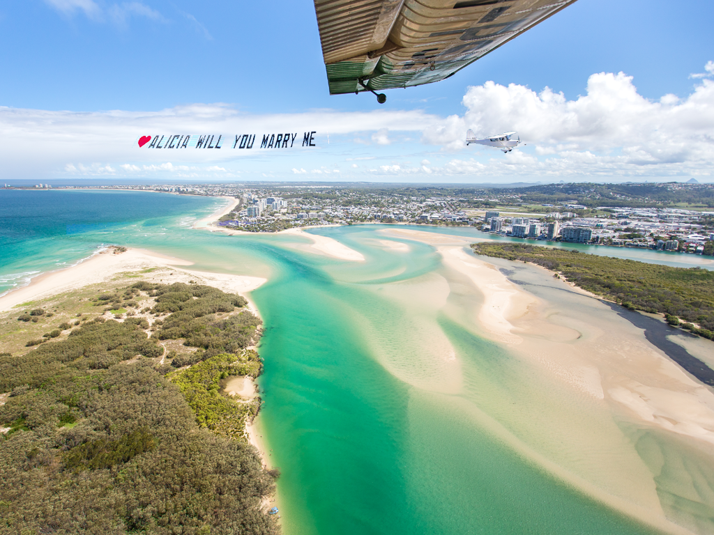 view from cockpit of wilga 80 seaplane of another aircraft and sky sign